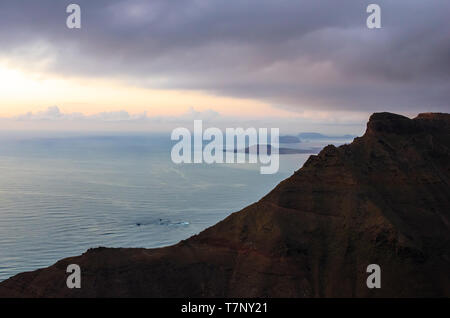 Landscape of cliffs of Mirador del Río and archipelago of Chinijo in background at sunset Stock Photo