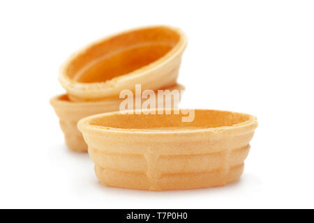 Empty baked tartlet closeup isolated on white background Stock Photo