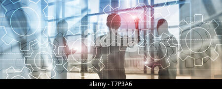 Double exposure gears mechanism on blurred background. Business and industrial process automation concept. Stock Photo