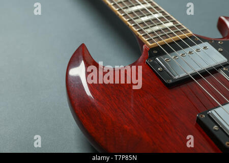 Beautiful six - string electric guitar on dark background, closeup Stock Photo