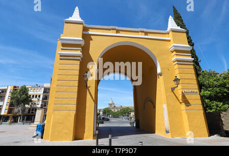 The Macarena Arch, lends its name to the neighbourhood. Next to it stands the Basilica of Macarena, building of recent construction in Seville. Stock Photo