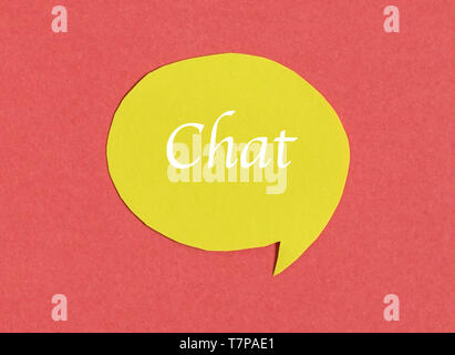 Symbol and concept for talking and message : yellow chat speech icon on red background Stock Photo