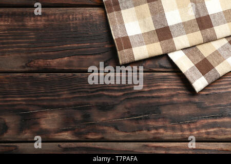 Fabric napkins on wooden background, space for text Stock Photo