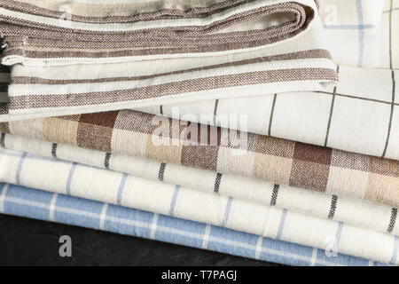 Stack of fabric napkins on black table, close up Stock Photo