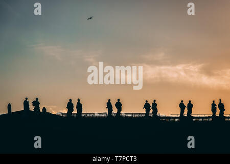 Sculptures of saints in Vatican. Silhouette on the evening sky background Stock Photo