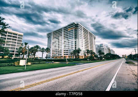 Boca Raton at sunset, Florida. Road,trees and buildings. Stock Photo