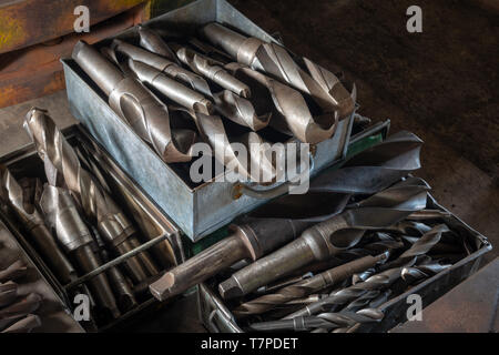 An assortment of metal drill bits in a box in a train engineers workshop, the Mining Museum, Lake District, UK Stock Photo