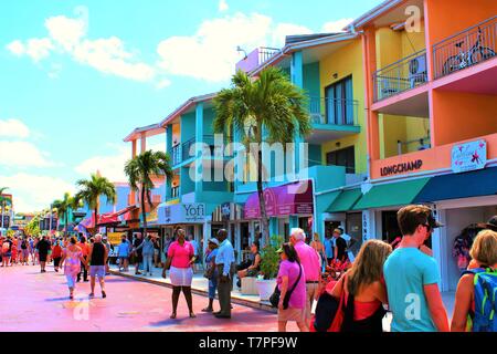 The Duty Free shopping street filled with tourists from a recently docked cruise ship, in St Johns port, Antigua. Stock Photo