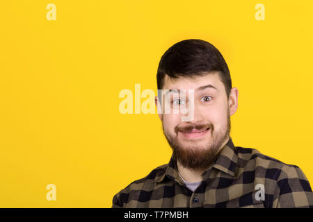 bearded smiling man, image over yellow background Stock Photo