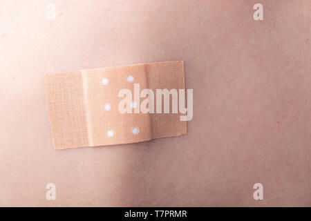 The wound is sealed with a medical adhesive plaster Stock Photo