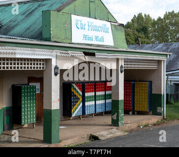 South Africa: The Himeville mini mall with mailboxes painted in the colours of the South African flag. Stock Photo