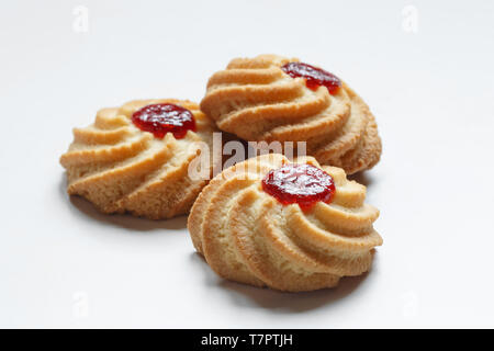 Close-up of three shortbread cookies isolated on white background. Stock Photo