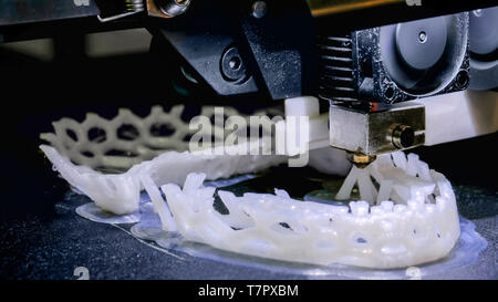 Three dimensional printing machine prints physical 3D model Stock Photo