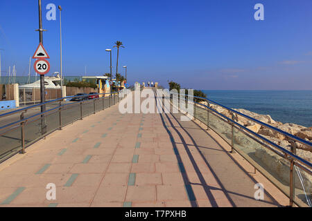 Walkway approach to top of Harbour Wall to Dénia Port Marina on the Costa Blanca, Spain Stock Photo