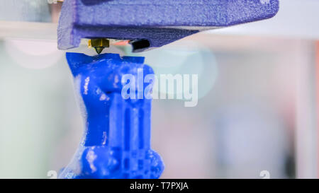Three dimensional printing machine prints physical 3D model Stock Photo