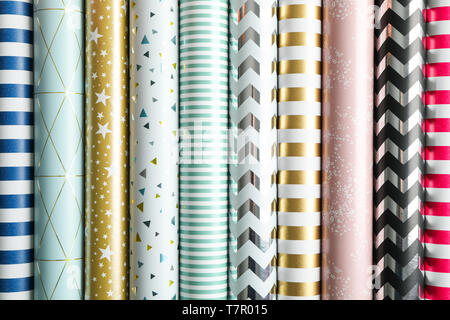 Rolls of festive wrapping paper as background. Top view Stock Photo