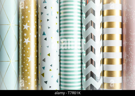 Rolls of festive wrapping paper as background. Top view Stock Photo