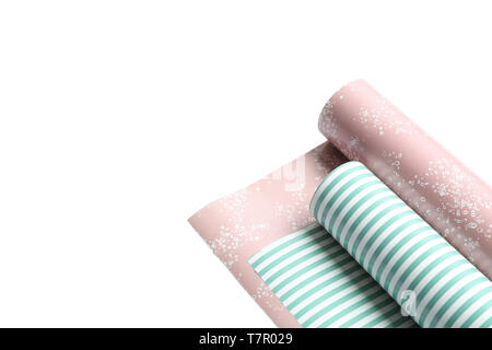Rolls of festive wrapping paper on white background. Space for text Stock Photo
