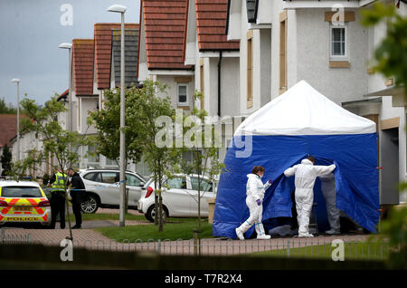 Police and forensic officers outside 61 Fairfeild Park, Monkton, Ayrshire, where 39 year-old Emma Faulds from Kilmarnock was last seen after she was reported missing. Stock Photo