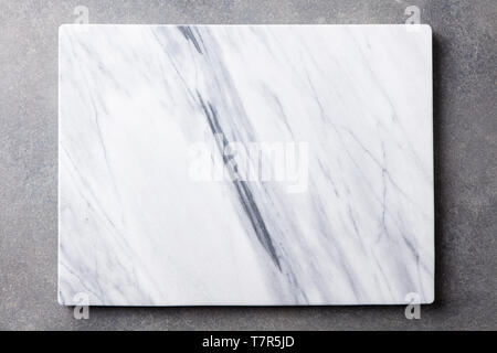 White marble texture board on grey background. Top view. Copy space. Stock Photo