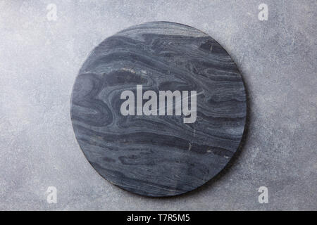 Black marble texture board on grey background. Top view. Copy space. Stock Photo