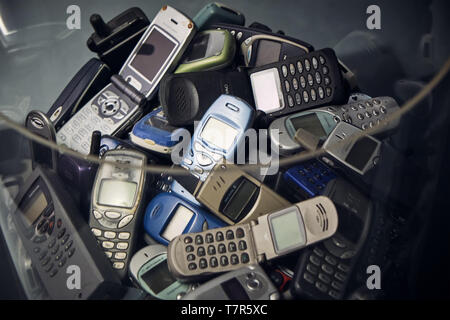 Milan Italy April 2019 - A group of old vintage mobile phones before smart phone revolution - recycling electronic device Stock Photo