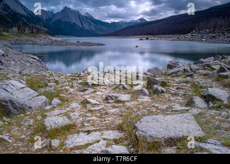 Medicine Lake in Jasper National Park. taken down by the sore line of the lake, cloudy overcast day Stock Photo