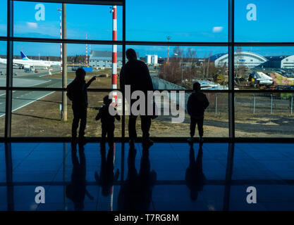 Family in a nice moment at Airport waiting for departure Stock Photo