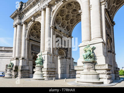 Low angle view of the eastern side of the arcade du Cinquantenaire, the triumphal arch erected in the Cinquantenaire park in Brussels, Belgium.
