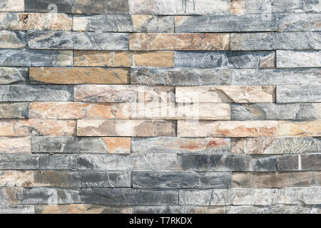 brick wall , texture of multi colored stone blocks closeup Stock Photo