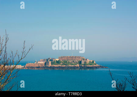 Channel Islands. Guernsey. St. Peter Port . Distant view of Castle Cornet from the cliff path. Stock Photo