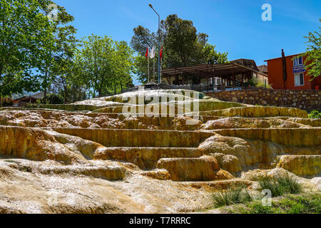 Karahayit town with red springs, near Pamukkale, tourist destination , Turkey, Red pools of Karahayit with the healthy mineral water in city of Denizl Stock Photo