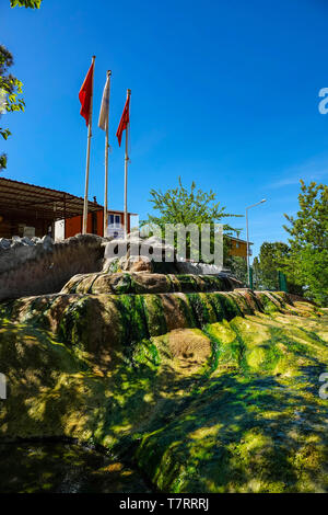 Karahayit town with red springs, near Pamukkale, tourist destination , Turkey, Red pools of Karahayit with the healthy mineral water in city of Denizl Stock Photo