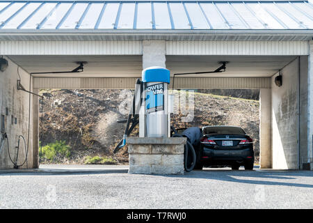Harrisburg, USA - April 6, 2018: Car wash drive in Pennsylvania with cars at power vac sign Stock Photo