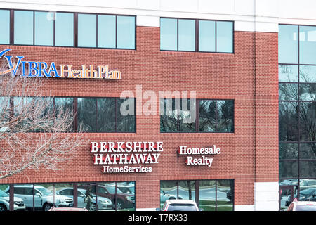 Harrisburg, USA - April 6, 2018: Berkshire Hathaway Home Services Homesale Realty and Vibra Health Plan store signs on building in Pennsylvania Stock Photo