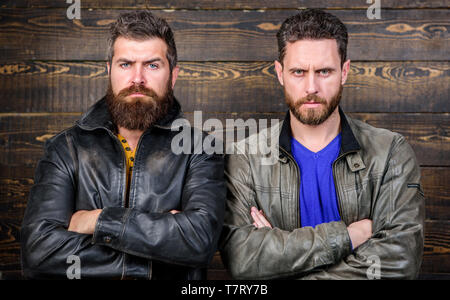 Brutality confidence and masculinity interconnection. Men brutal bearded hipster. Exude masculinity. Confident competitors strict glance. Masculinity concept. Masculinity attributes. True man temper. Stock Photo