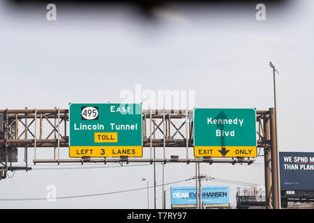 Weehawken, USA - April 6, 2018: Exit sign in New Jersey for Lincoln Tunnel toll on 495 east and Kennedy Boulevard Stock Photo