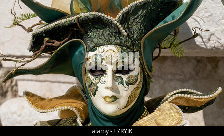 Reveller In Traditional Elaborate Mask And Costume At Venice Carnival (Carnevale di Venezia). Venice, Veneto, Italy, Europe Stock Photo