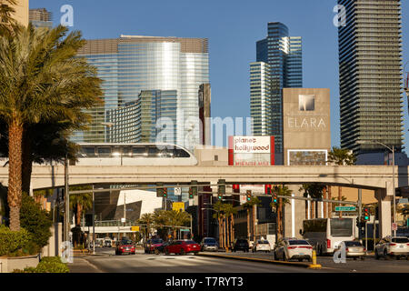 Las Vegas, Paradise, Nevada USA, skyline of the strip, Driverless straddle beam Innovia Monorail crossing  E Harmon Avenue Stock Photo