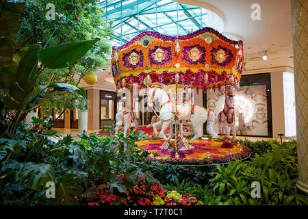 Las Vegas, Paradise, Nevada USA, Five star Wynn hotel and Casino decorated forest walkway with flower carousel Stock Photo