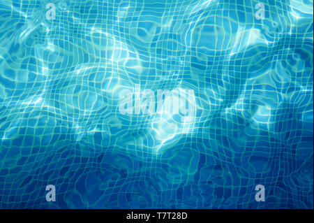 Mosaic tile in blue swimmng pool water texture background Stock Photo