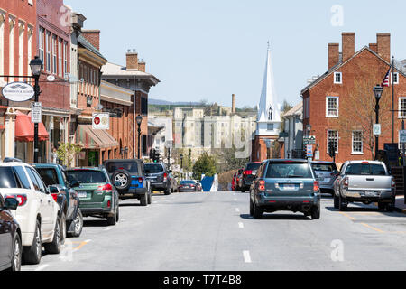 Lexington, USA - April 18, 2018: Historic downtown town city in Virginia countryside Shenandoah mountain village, signs for shops and stores, First Ba Stock Photo