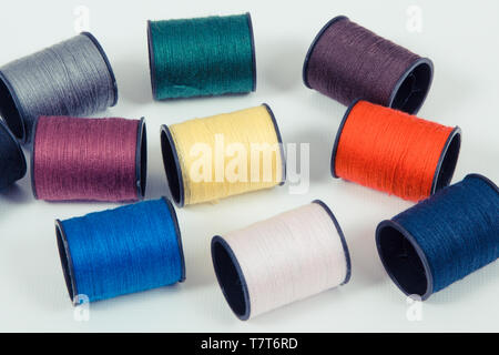 Spools of colorful thread using for needlework, embroidery and sewing Stock Photo