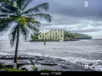 French Guiana. 10th Apr, 2000. A view of the rocky islet of Devils Island (ÃŽle du Diable) from Ile Royale, one of the three islands (Royale, Saint-Joseph, and Diable) of the volcanic ÃŽles du Salut group off French Guiana, collectively called Devils Island (ÃŽle du Diable). Now a nature reserve, serving tourists and cruise ship passengers, visitors are not allowed on small Devils Island but tour the decaying old prison facilities on nearby Isle Royale. Credit: Arnold Drapkin/ZUMA Wire/Alamy Live News Stock Photo