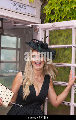 Chester, UK. 9th May, 2019 Trinny Brookfield at Boodles May Festival. The famous horse racing event welcomes fashionistas & street style people on this very special parade of the finest expensive female fashions. Glamorous racegoers women in fancy outfits, ladies in figure-hugging suits, floral dresses, lovely, charming, elegant, splendid, impressive, magnificent, prestigious fashionable frocks, plush opulent, ritzy patrons, lovely, charming, elegant, splendid hats, headbands & fashion finery wearing high end couture attend Chester Races. Stock Photo