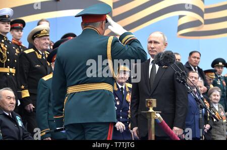 Russian President Vladimir Putin is saluted by Kremlin Guards as he ...