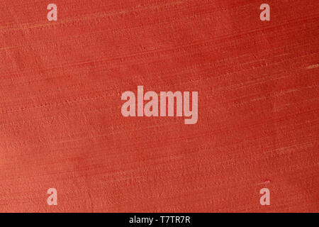 Close up of the woolen fabric of red-orange pantone color. Abstract canvas background, empty template. Stock Photo