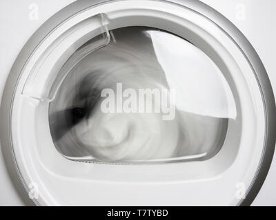 washing machine porthole closeup working front view Stock Photo