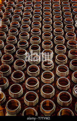 Many glass jars for empty medicines assorted in a row, chemical pharmaceutical industry concept. Stock Photo