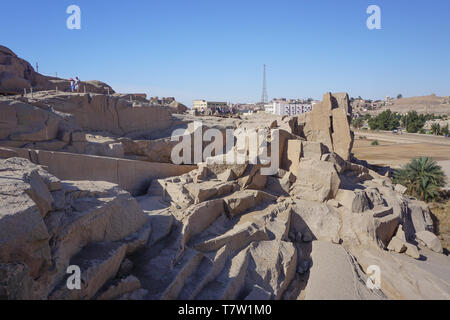 Aswan, Egypt: Tourists visit the unfinished obelisk, originally ordered by Hatshepsut (1508–1458 BC), in a stone quarry in Aswan, Egypt. Stock Photo